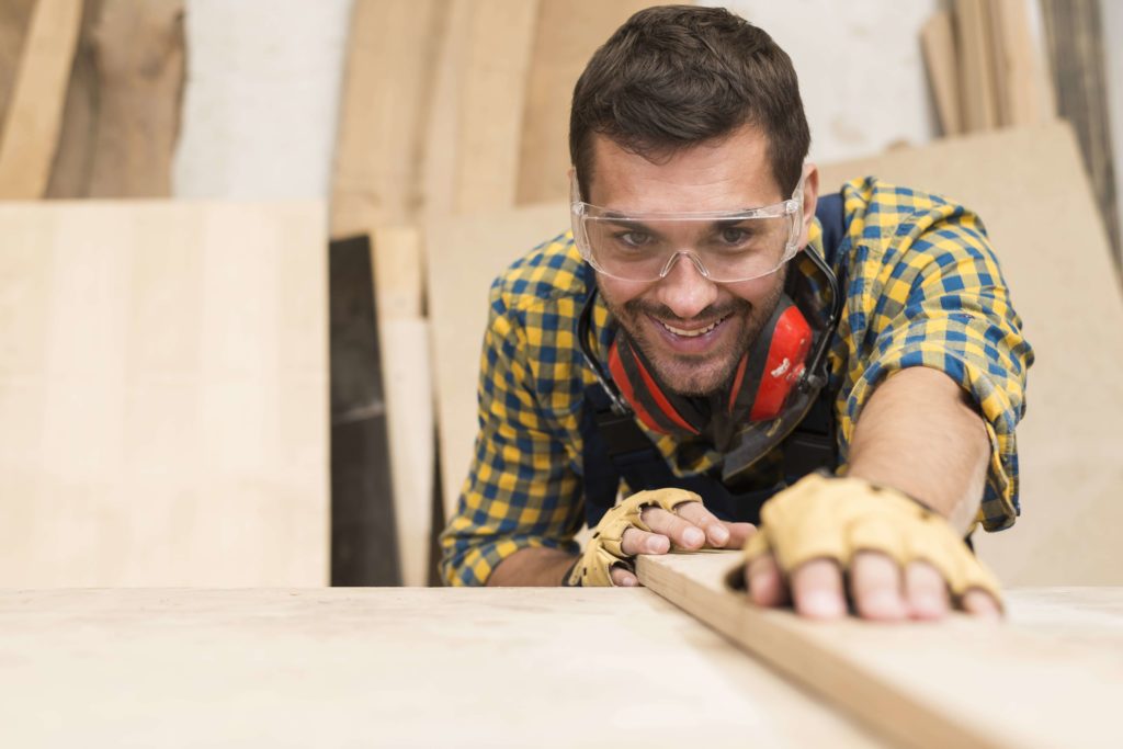 Male carpenter - adjusting